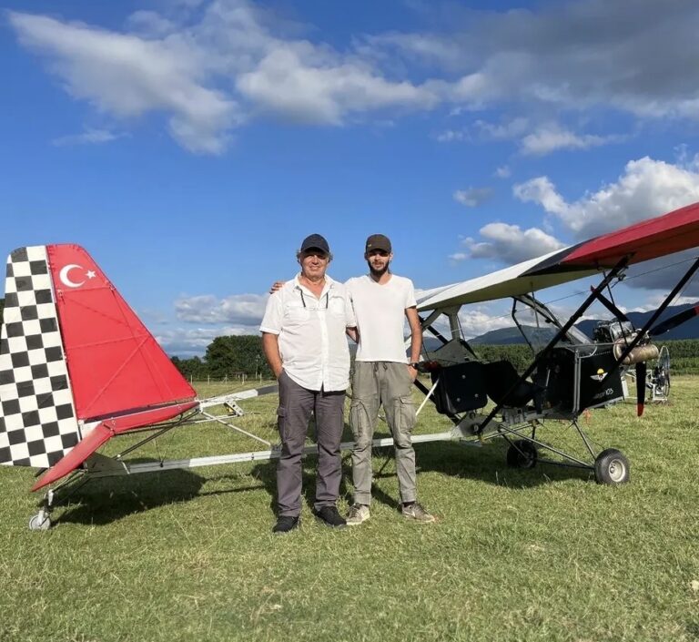 Atıl and his father in front of the ultralight aircraft they built together